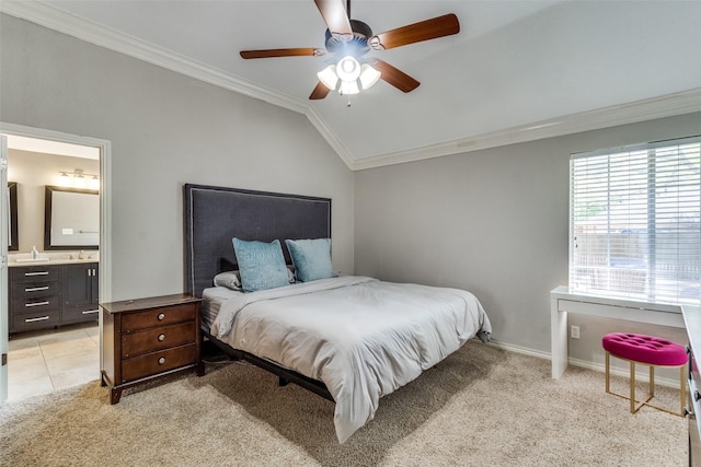bedroom with ornamental molding, a sink, lofted ceiling, and light carpet