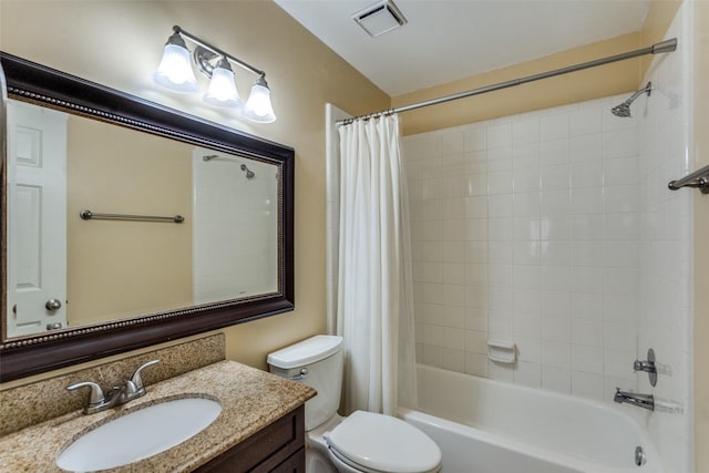 full bathroom with vanity, toilet, visible vents, and shower / bath combo with shower curtain