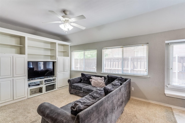 living room with light colored carpet, baseboards, and ceiling fan
