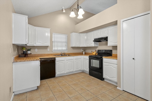 kitchen featuring vaulted ceiling, light tile patterned floors, a sink, black appliances, and under cabinet range hood