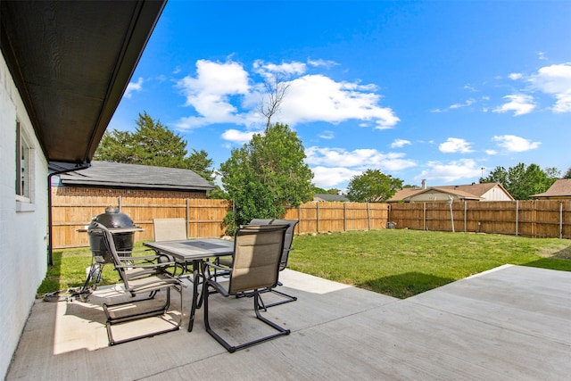 view of patio with a fenced backyard, grilling area, and outdoor dining space