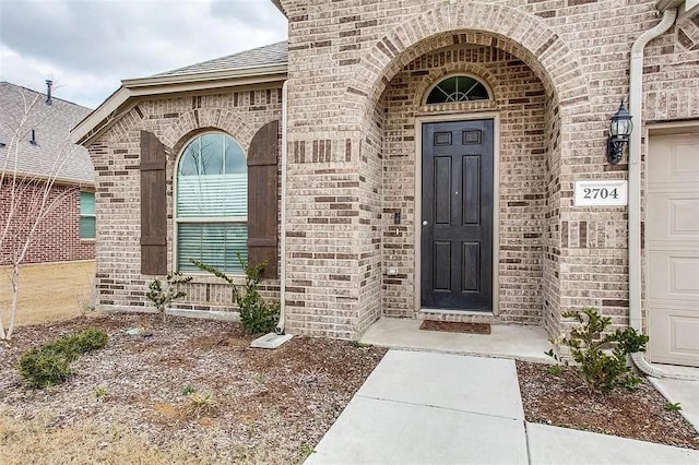 2704 Dancing Flame Dr, Denton, TX 76201 - entrance to property featuring brick siding and roof with shingles