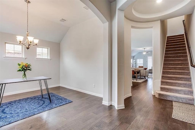 2704 Dancing Flame Dr, Denton, TX 76201 - foyer with stairs, wood finished floors, arched walkways, baseboards, and a chandelier