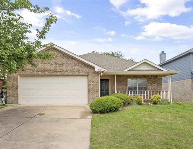 single story home featuring brick siding, a front yard, concrete driveway, an attached garage, and a porch