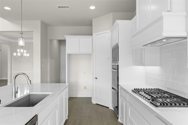 4524 Sky Harbor Dr, Rockwall, TX 75087 - kitchen featuring white cabinets, appliances with stainless steel finishes, a sink, decorative backsplash, and visible vents