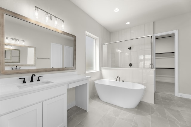 4524 Sky Harbor Dr, Rockwall, TX 75087 - bathroom featuring a freestanding bath, a shower stall, vanity, marble finish floor, and recessed lighting