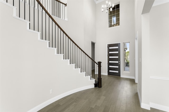 4524 Sky Harbor Dr, Rockwall, TX 75087 - foyer entrance with stairs, wood finished floors, baseboards, a high ceiling, and a notable chandelier