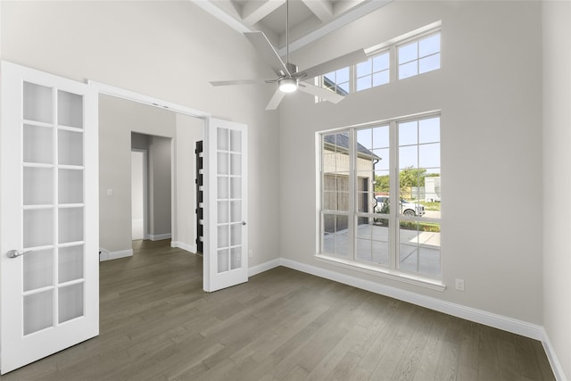 4524 Sky Harbor Dr, Rockwall, TX 75087 - empty room featuring baseboards, french doors, dark wood-type flooring, and a towering ceiling