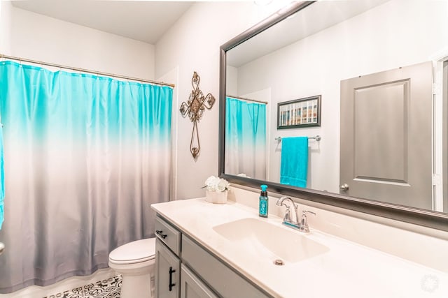 full bath with vanity, tile patterned flooring, curtained shower, and toilet