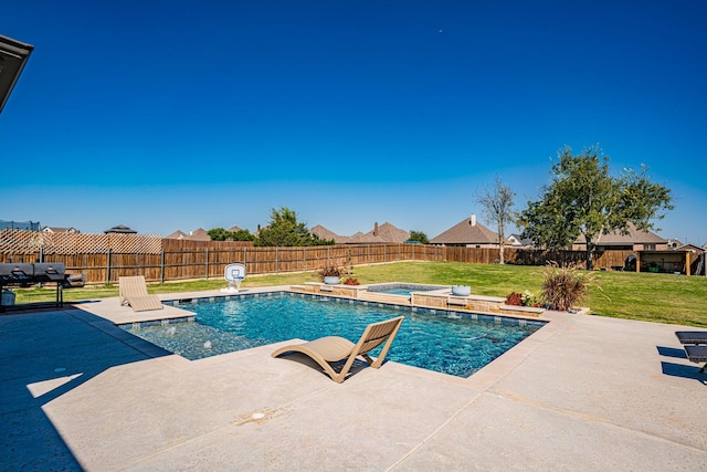 view of pool featuring a lawn, a patio, an in ground hot tub, and a fenced backyard