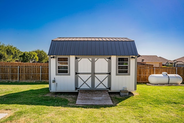 view of shed featuring a fenced backyard