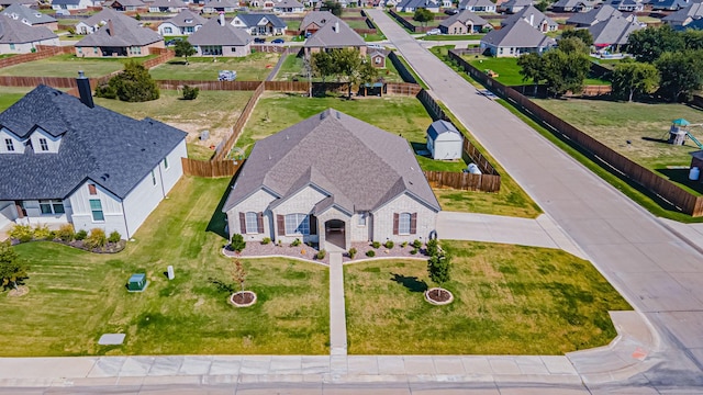 birds eye view of property with a residential view