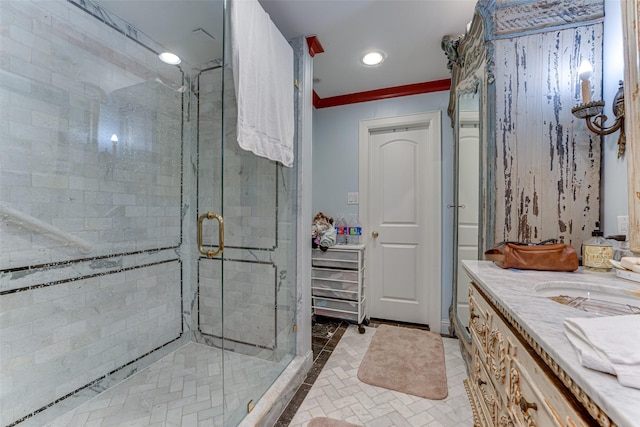 bathroom featuring vanity, recessed lighting, ornamental molding, and a stall shower