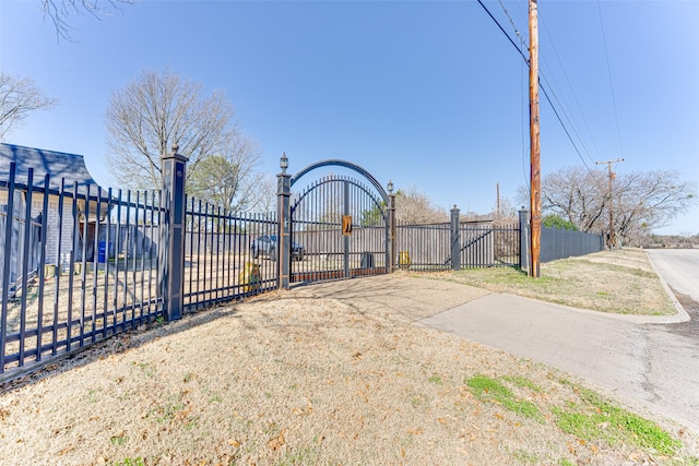 view of gate featuring fence
