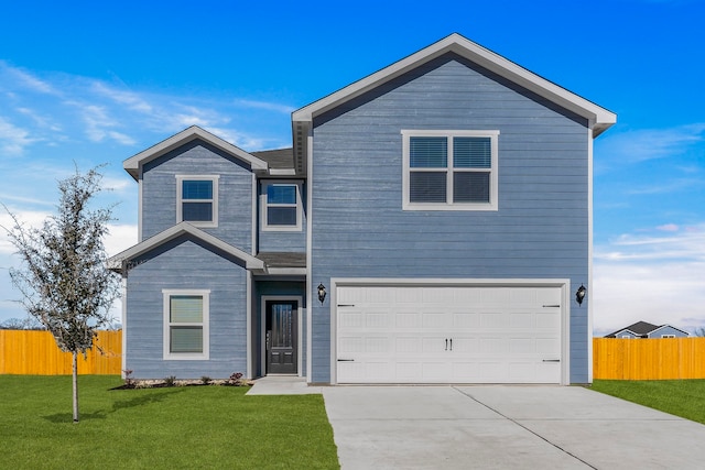 view of front facade with fence, an attached garage, driveway, and a front lawn