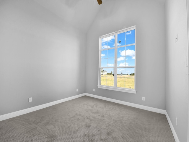 unfurnished room with vaulted ceiling, baseboards, ceiling fan, and carpet flooring