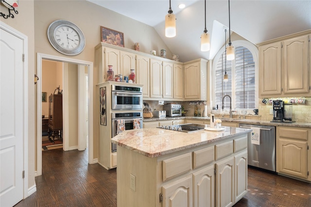 kitchen with lofted ceiling, dark wood-style floors, a center island, appliances with stainless steel finishes, and backsplash