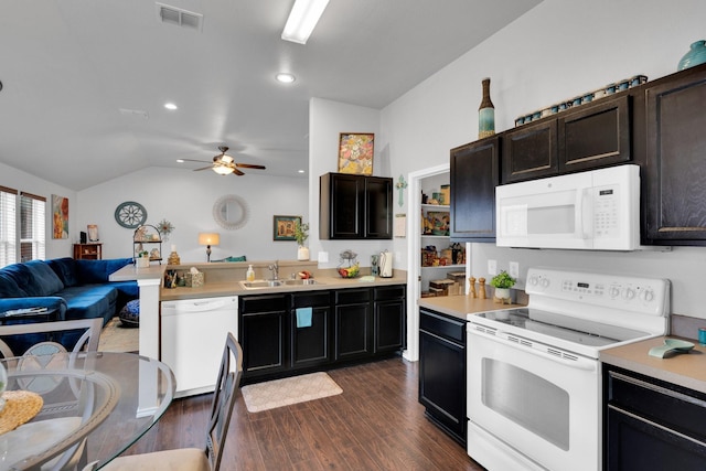 kitchen featuring visible vents, dark wood finished floors, a sink, open floor plan, and white appliances
