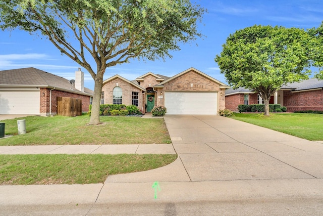 ranch-style house with brick siding, a garage, a front lawn, and concrete driveway