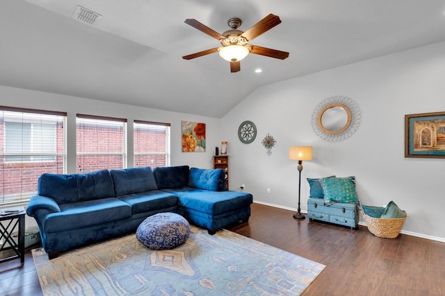 living room with baseboards, visible vents, wood finished floors, and lofted ceiling