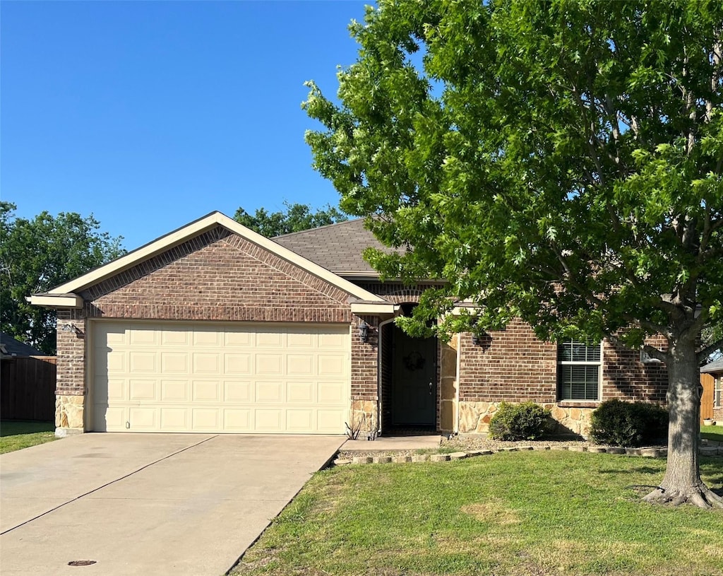single story home with concrete driveway, brick siding, an attached garage, and stone siding