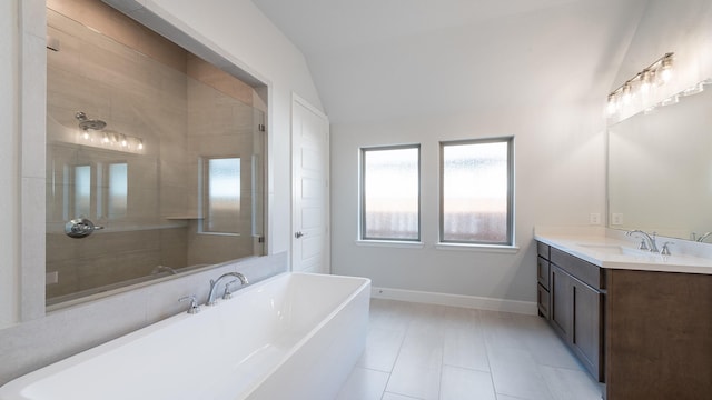 7313 Wayward Wind Dr, Fort Worth, TX 76179 - bathroom featuring lofted ceiling, vanity, tile patterned flooring, a freestanding bath, and tiled shower