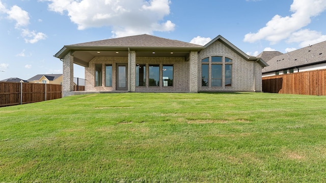 7313 Wayward Wind Dr, Fort Worth, TX 76179 - rear view of house featuring a fenced backyard and brick siding