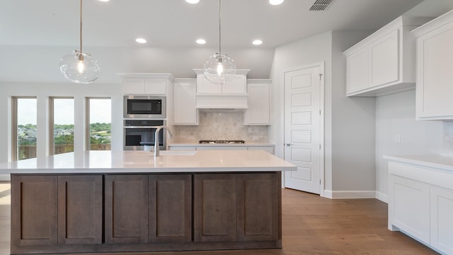 7313 Wayward Wind Dr, Fort Worth, TX 76179 - kitchen featuring stainless steel appliances, recessed lighting, decorative backsplash, white cabinets, and light countertops