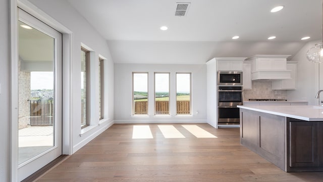 7313 Wayward Wind Dr, Fort Worth, TX 76179 - kitchen with appliances with stainless steel finishes, light countertops, white cabinets, backsplash, and recessed lighting