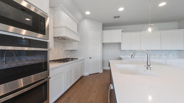 7313 Wayward Wind Dr, Fort Worth, TX 76179 - kitchen featuring appliances with stainless steel finishes, light countertops, recessed lighting, decorative backsplash, and white cabinets