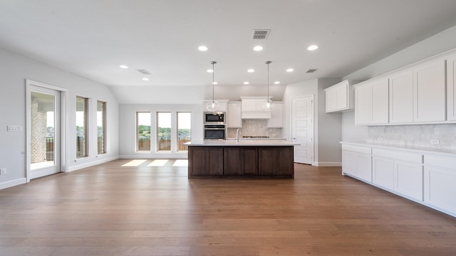 7313 Wayward Wind Dr, Fort Worth, TX 76179 - kitchen with stainless steel appliances, open floor plan, backsplash, wood finished floors, and recessed lighting