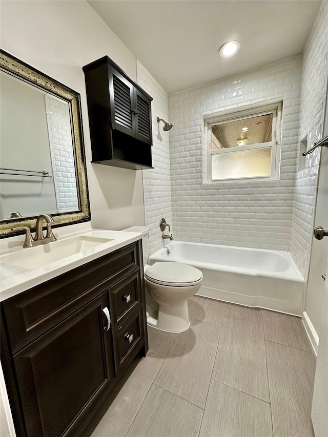 full bath featuring vanity, toilet, and bathtub / shower combination