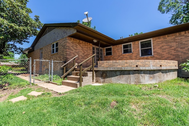 10816 Palace Way, Dallas, TX 75218 - rear view of property featuring brick siding and a gate