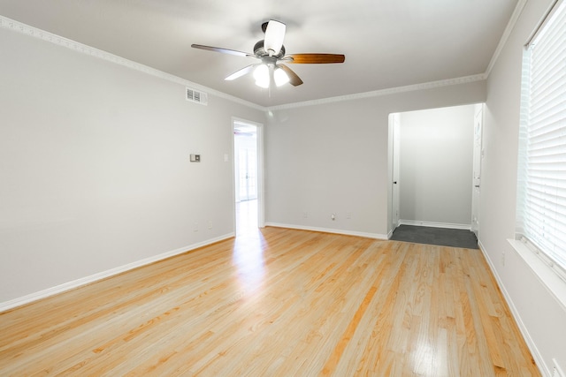 10816 Palace Way, Dallas, TX 75218 - unfurnished room with ceiling fan, wood finished floors, baseboards, and crown molding