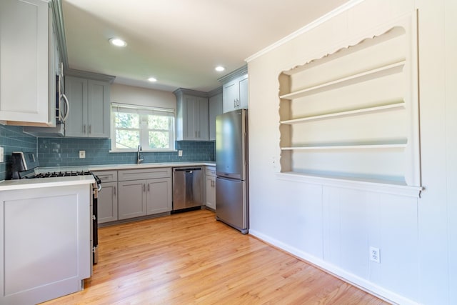 10816 Palace Way, Dallas, TX 75218 - kitchen with stainless steel appliances, gray cabinets, a sink, decorative backsplash, and recessed lighting