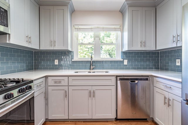10816 Palace Way, Dallas, TX 75218 - kitchen featuring stainless steel appliances, a sink, light countertops, and tasteful backsplash