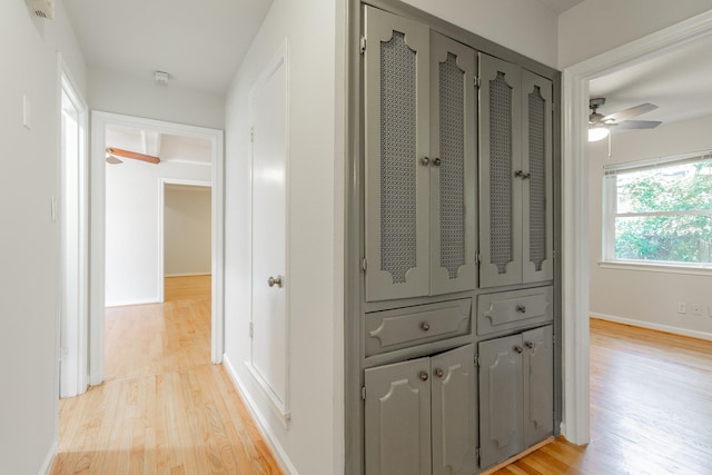 10816 Palace Way, Dallas, TX 75218 - hallway with light wood finished floors and baseboards