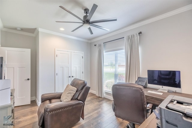 office space featuring crown molding, a ceiling fan, and wood finished floors