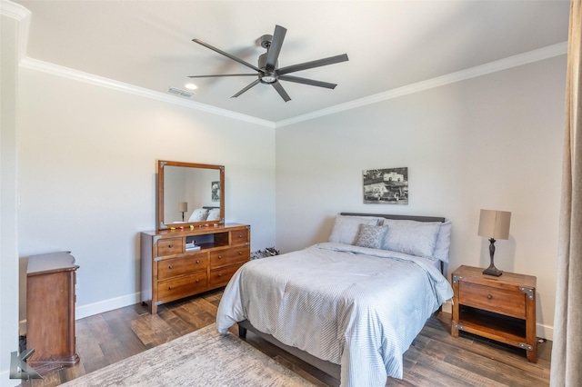 bedroom with crown molding, visible vents, wood finished floors, baseboards, and recessed lighting