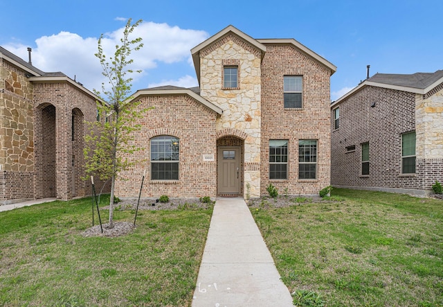 view of front of property with brick siding and a front lawn