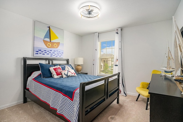 bedroom with carpet floors and baseboards