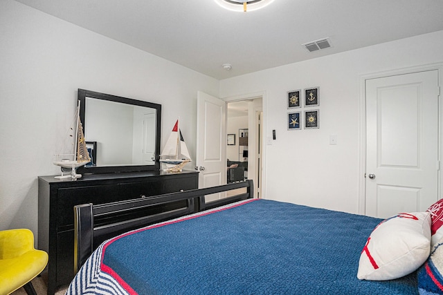 bedroom featuring visible vents