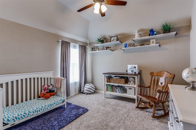 bedroom with carpet floors, a ceiling fan, baseboards, and vaulted ceiling