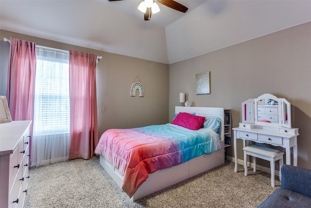 bedroom with a ceiling fan, light carpet, and lofted ceiling