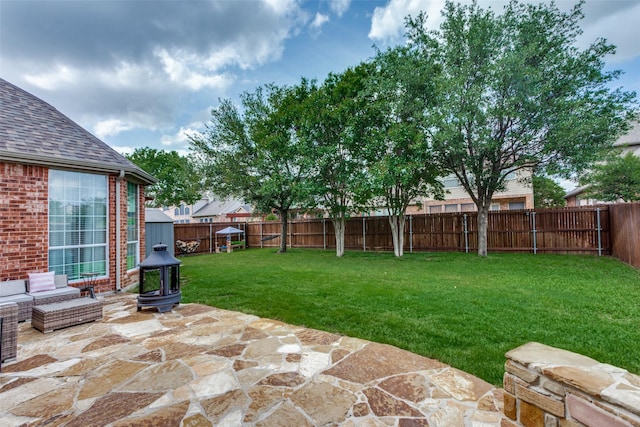 view of yard with a fenced backyard and a patio area