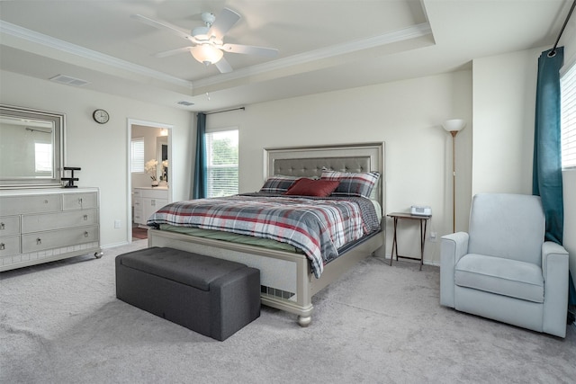 bedroom featuring visible vents, carpet flooring, a raised ceiling, and ornamental molding
