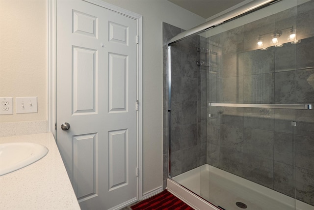 bathroom featuring vanity and a shower stall