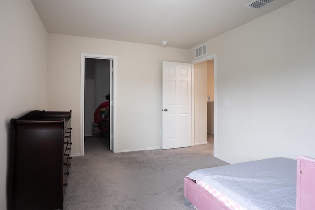 carpeted bedroom with baseboards, visible vents, and a spacious closet