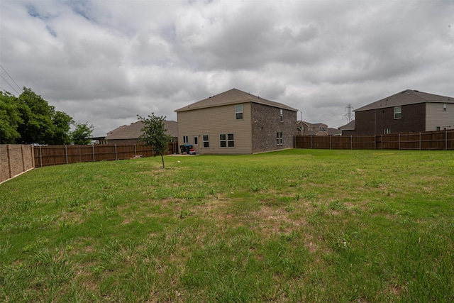 view of yard with a fenced backyard