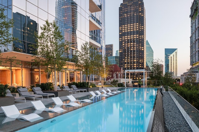 view of pool with a view of city